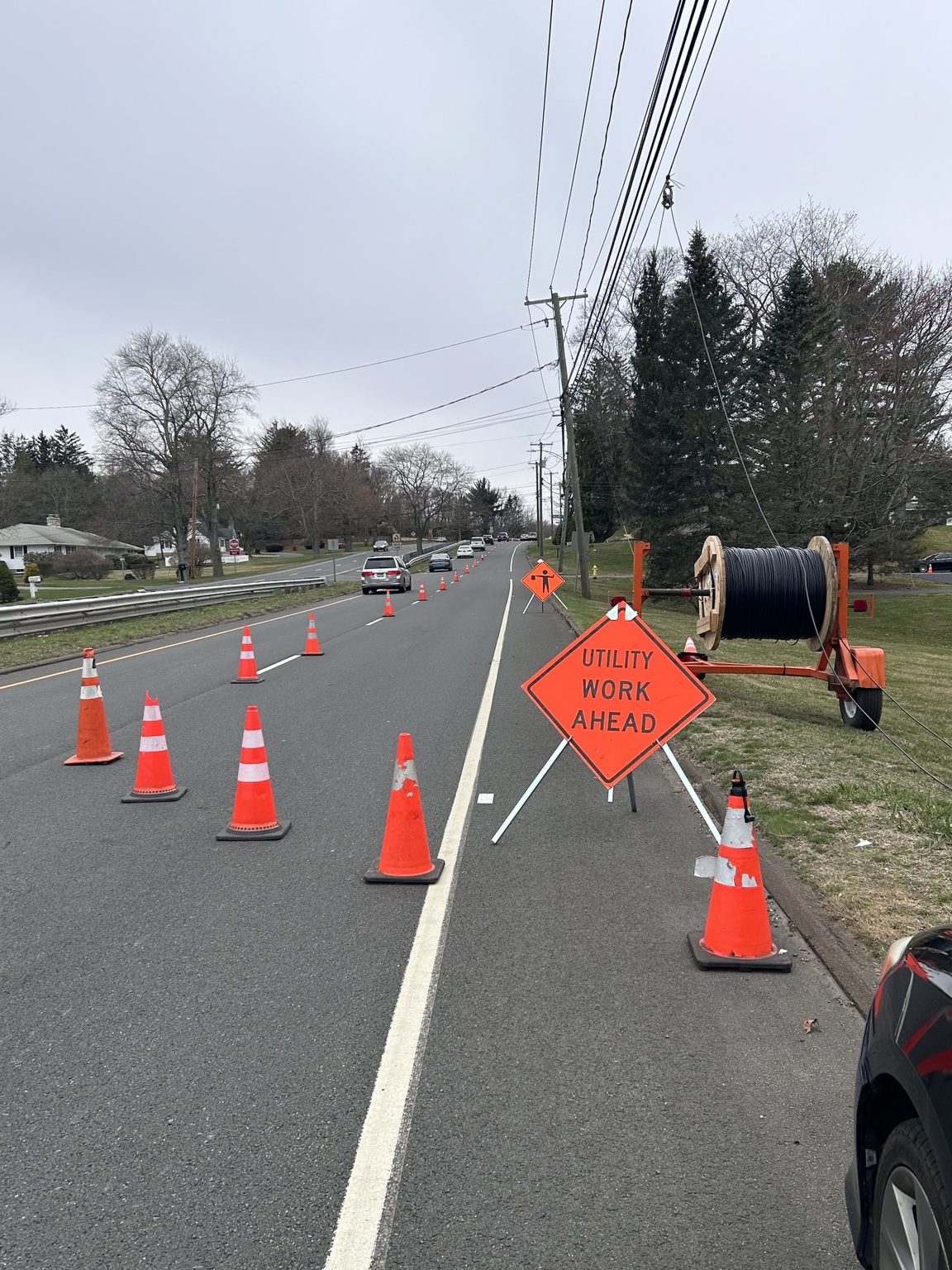 Cones and signs alongside utility cable installation